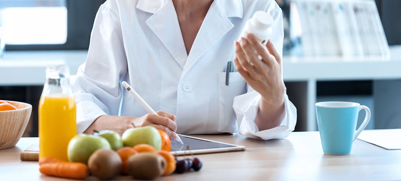 Registered dietitian evaluating vitamins for bariatric patients 