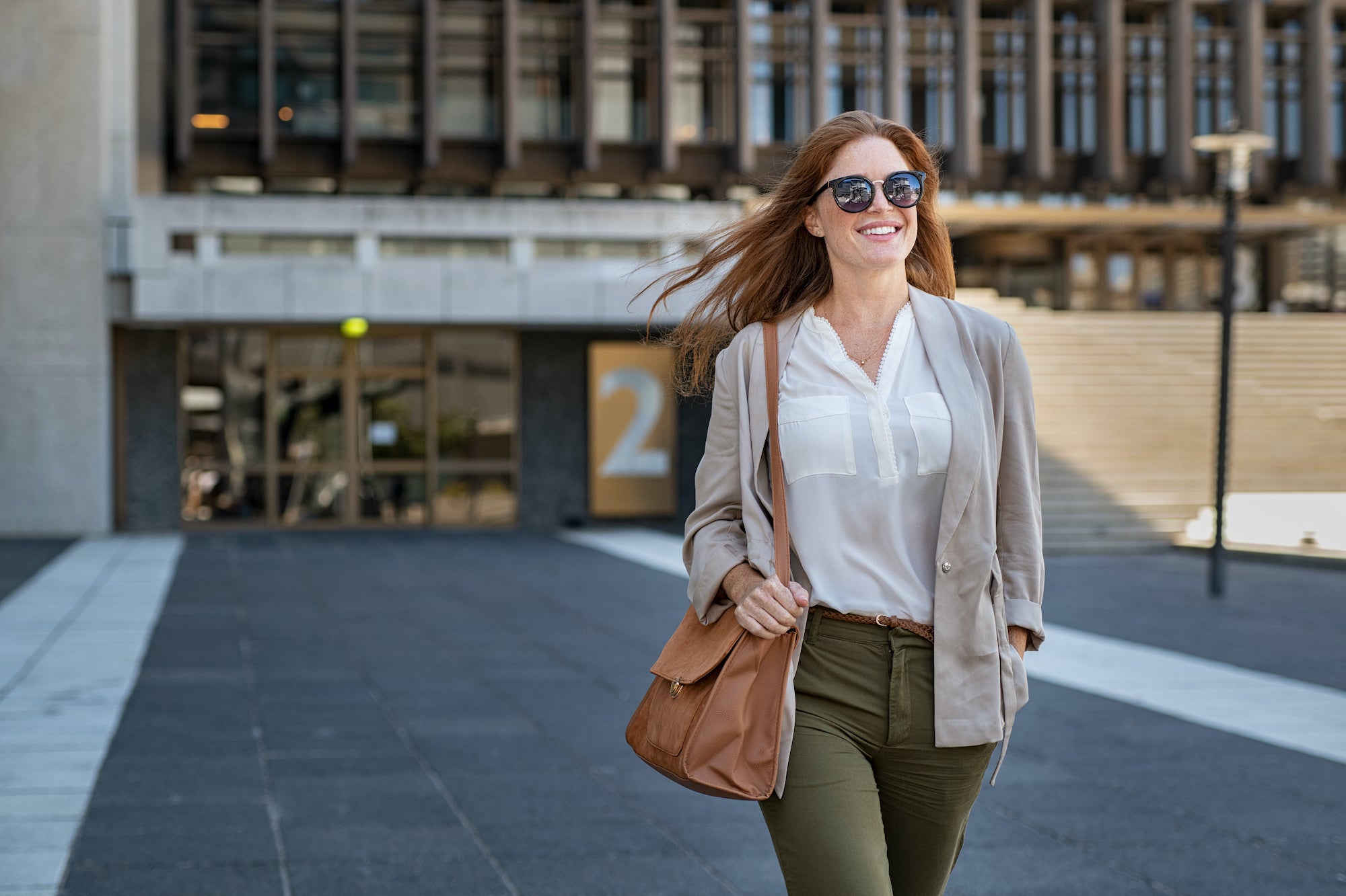 Confident woman walking down the street