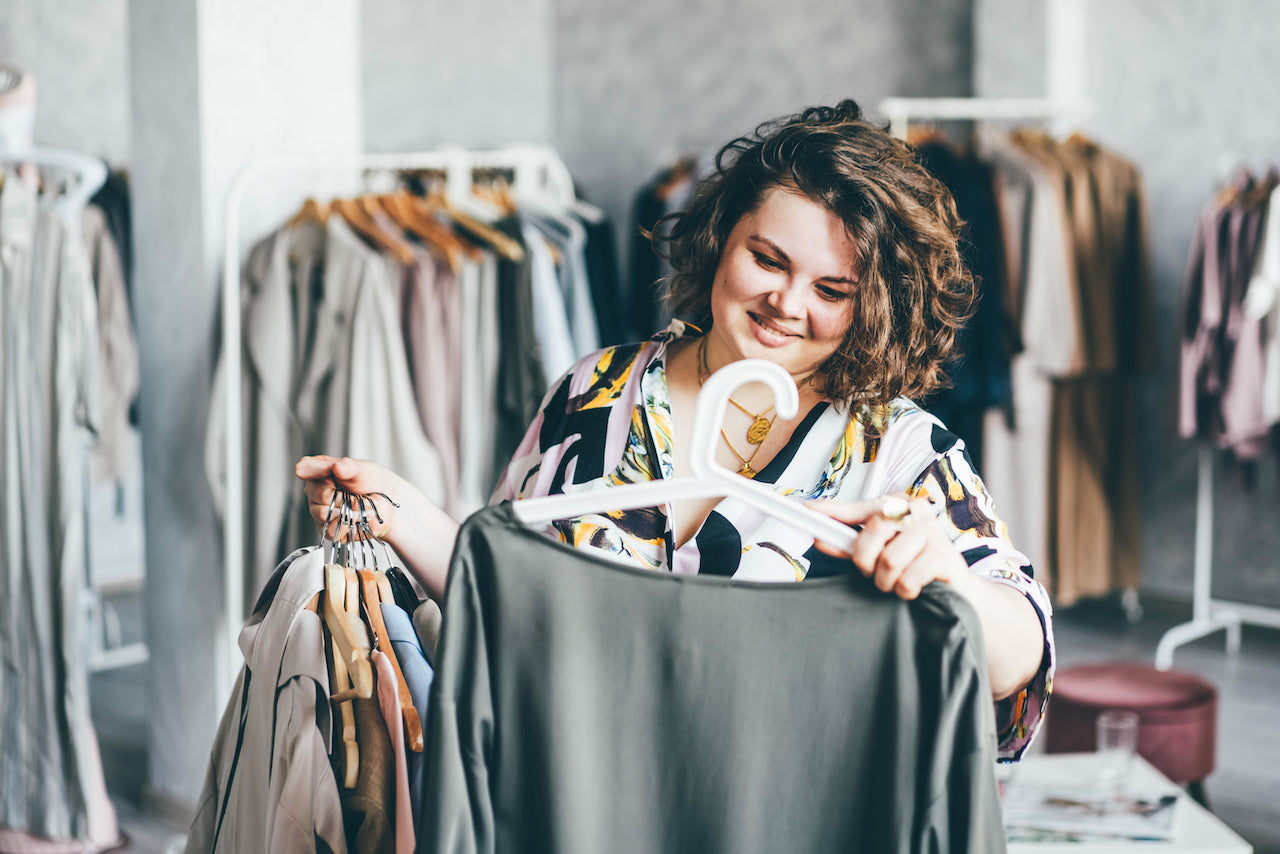 Woman choosing clothes after bariatric surgery